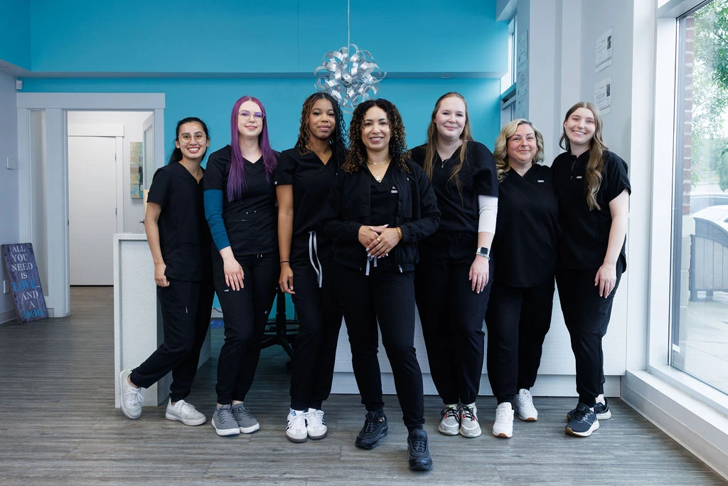 The Nolan Hill Veterinary Hospital team — Dr. Rowe with Emma, Lauren, Daija, Keeley, Wendy and Jaime — standing together in the clinic reception